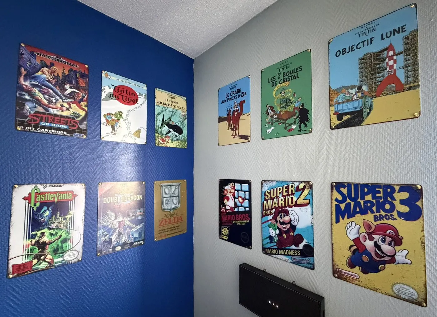 A wall decorated with classic retro video game posters